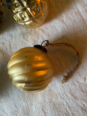 A Set of Golden Glass Baubles